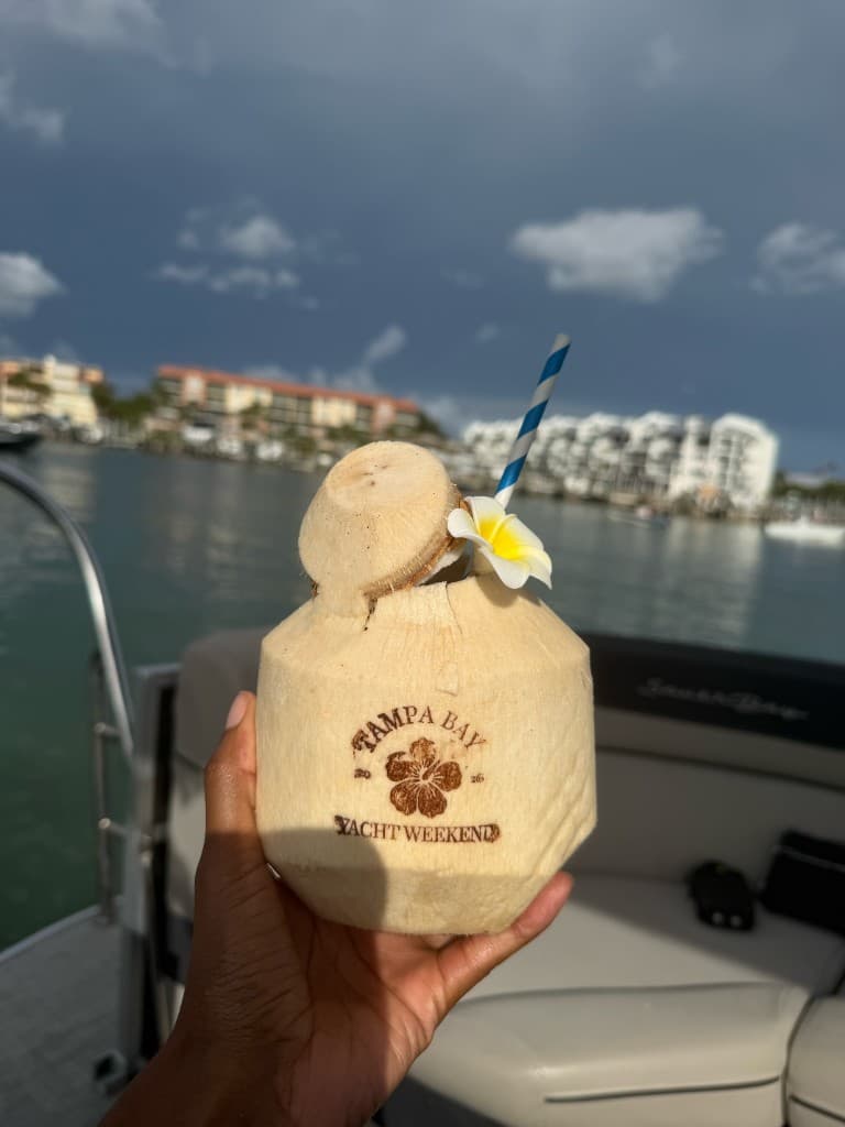 Tampa Bay Yacht Weekend branded coconut on a boat